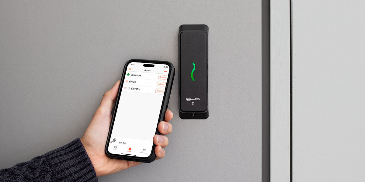 Person using their mobile credential at a Gallagher enterprise security t15 door reader